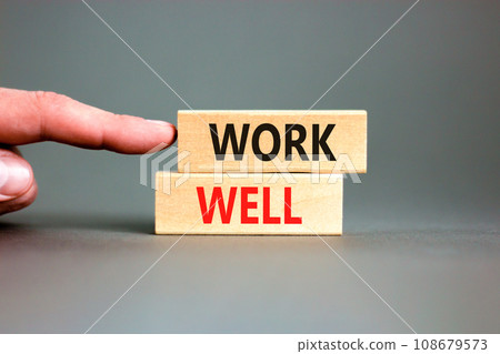Work well symbol. Concept words Work well on beautiful wooden block. Beautiful grey table grey background. Businessman hand. Business marketing, motivational work well concept. Copy space. 108679573
