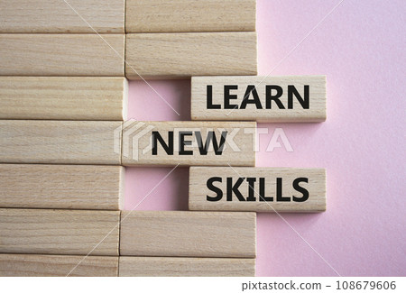 Learn new skills symbol. Concept words Learn new skills on wooden blocks. Beautiful pink background. Business and Learn new skills concept. Copy space. Learn new skills symbol. Concept words Learn new skills on wooden blocks. Beautiful pink background. Business and Learn new skills concept. Copy space. 108679606