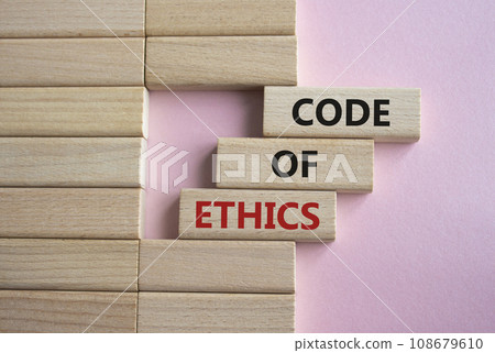 Code of ethics symbol. Concept words Code of ethics on wooden blocks. Beautiful pink background. Business and Code of ethics concept. Copy space. Code of ethics symbol. Concept words Code of ethics on wooden blocks. Beautiful pink background. Business and Code of ethics concept. Copy space. 108679610