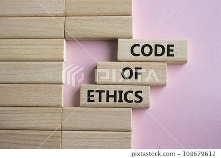 Code of ethics symbol. Concept words Code of ethics on wooden blocks. Beautiful pink background. Business and Code of ethics concept. Copy space. Code of ethics symbol. Concept words Code of ethics on wooden blocks. Beautiful pink background. Business and Code of ethics concept. Copy space. 108679612