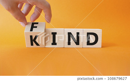 Fine and Kind symbol. Businessman hand turns wooden cube and changes word Kind to Find. Beautiful orange background. Business and Fine and Kind concept. Copy space. Fine and Kind symbol. Businessman hand turns wooden cube and changes word Kind to Find. Beautiful orange background. Business and Fine and Kind concept. Copy space. 108679627