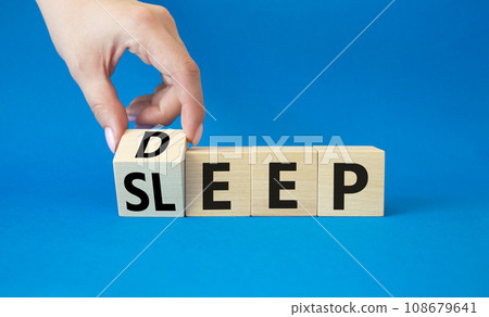 Deep Sleep symbol. Doctor hand turns wooden cube and changes word Sleep to Deep. Beautiful blue background. Medicine and Deep Sleep concept. Copy space Deep Sleep symbol. Doctor hand turns wooden cube and changes word Sleep to Deep. Beautiful blue background. Medicine and Deep Sleep concept. Copy space 108679641