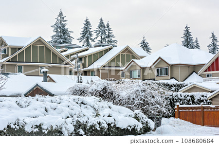 Roof of residential townhouses on winter season Roof of residential townhouses on winter season 108680684