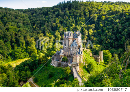 Eltz Castle, a medieval castle located in Germany, Rheinland Pfalz, Mosel region. Beautiful old castle, famous tourist attraction on sunny summer day, empty, without people, nobody. Eltz Castle, a medieval castle located in Germany, Rheinland Pfalz, Mosel region. Beautiful old castle, famous tourist attraction on sunny summer day, empty, without people, nobody. 108680747