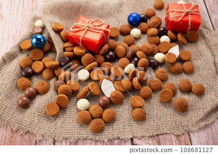 Dutch holiday Sinterklaas background with traditional sweets pepernoten for St. Nicholas Day Dutch holiday Sinterklaas background with traditional sweets pepernoten for St. Nicholas Day 108681127