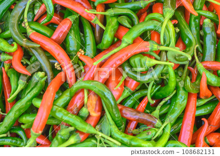 fresh appetizing red and green hot peppers at the bazaar on the island of Cyprus in autumn 1 108682131
