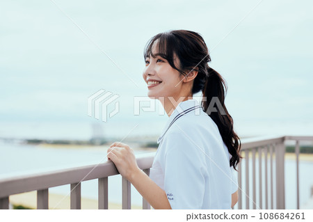 Nurse looking up at the sky on the rooftop 108684261