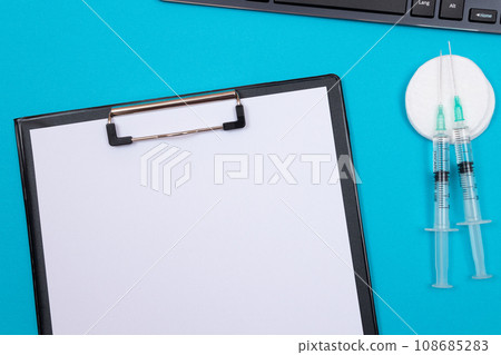 Vaccination or Revaccination Concept - Two Medical Syringe on Blue Table 108685283