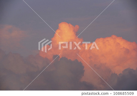 Ruin clouds vividly colored by the setting sun Ruin clouds vividly colored by the setting sun 108685509