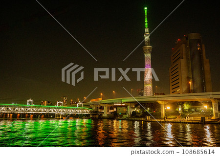 Be healed by the night view of the Sky Tree and Sumida River with Chikawa character writing Be healed by the night view of the Sky Tree and Sumida River with Chikawa character writing 108685614