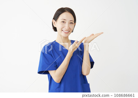 Doctor pointing to the right side with his palm, white background Doctor pointing to the right side with his palm, white background 108686661