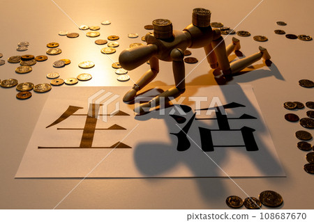 A doll with drooping heads struggling to survive among scattered coins 108687670