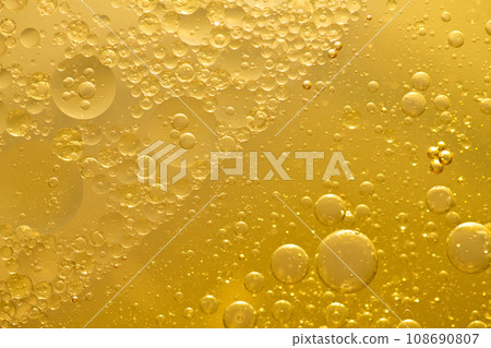 Oil bubble texture on gold background. Oil bubble texture on gold background. 108690807