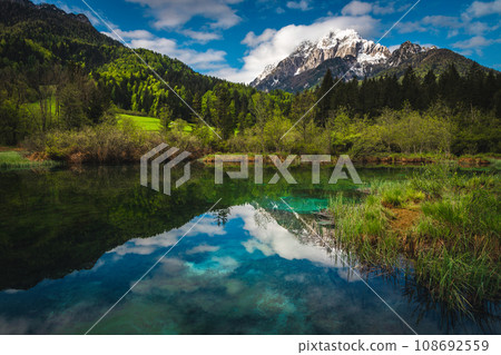 Beautiful clean mountain lake and snowy peaks in Slovenia Beautiful clean mountain lake and snowy peaks in Slovenia 108692559
