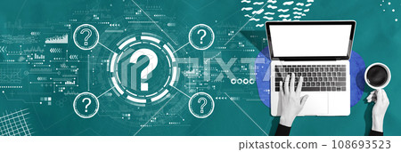 Question marks with person using a laptop Question marks with person using a laptop 108693523