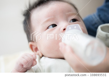 Baby drinking milk 108693531