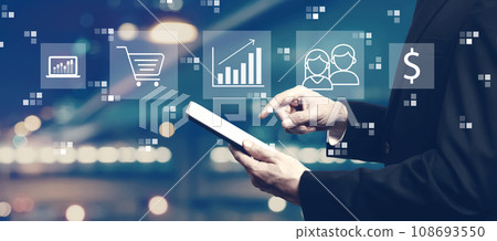Marketing concept with businessman using a tablet Marketing concept with businessman using a tablet 108693550