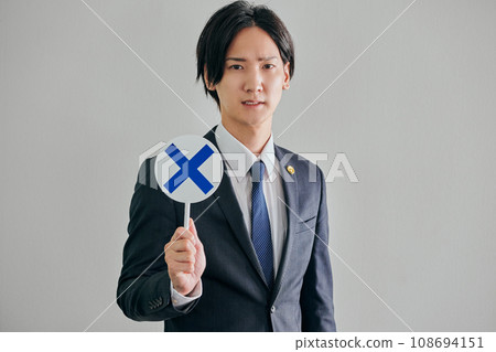 A male lawyer making a judgment against a white background A male lawyer making a judgment against a white background 108694151
