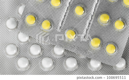 Pills in plastic package. Health insurance and Global healthcare concept. Pharmaceutical industry. Pills in plastic package. Health insurance and Global healthcare concept. Pharmaceutical industry. 108695511