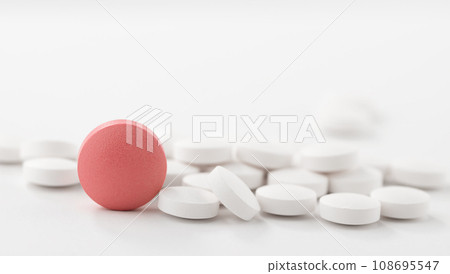 Red and white pills on white background. Heap of assorted various medicine tablets and pills. 108695547