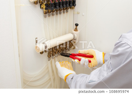 Inspection, maintenance, and repair image of residential floor heating equipment Inspection, maintenance, and repair image of residential floor heating equipment 108695974