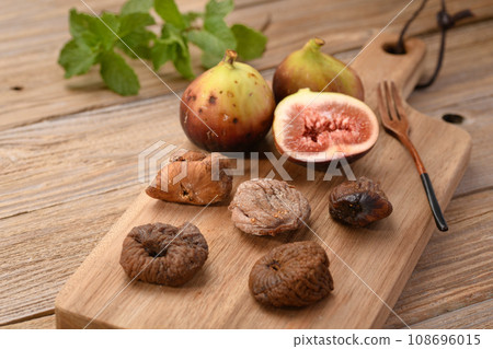 Dried figs old board background Dried figs old board background 108696015