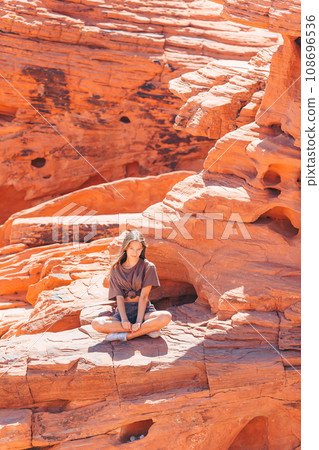 Young girl on trail at Fire Valley in Utah Young girl on trail at Fire Valley in Utah 108696536