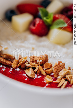 Sweet milk semolina porridge with strawberries on beautiful plate. Delicious breakfast for children 108698151