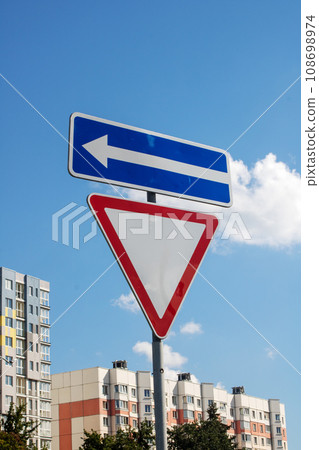 Secondary road road sign and arrows closeup 108698974