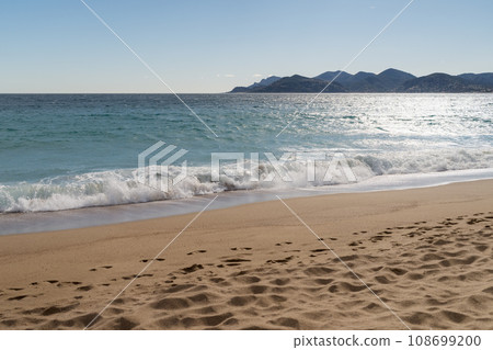 Sand beach of South France during spring with sea waves Sand beach of South France during spring with sea waves 108699200
