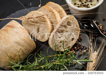 Italian ciabatta bread cut in slices. Italian ciabatta bread cut in slices. 108701643