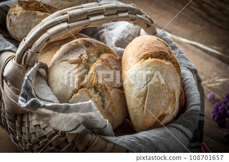 Roll breads in basket on table. 108701657
