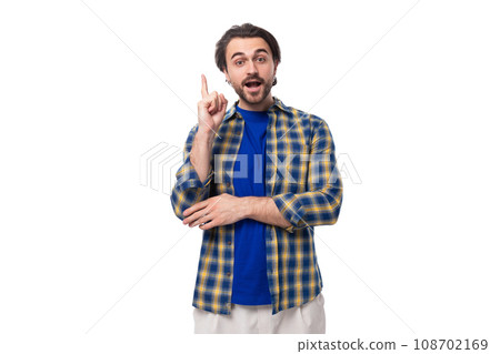 happy brunette brutal man with a beard in a plaid shirt has an idea 108702169