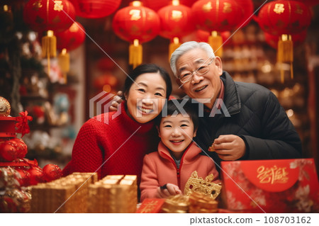 Multi generation family celebrating Chinese New Year Multi generation family celebrating Chinese New Year 108703162