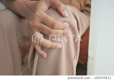 Close up on women suffering knee joint pain Close up on women suffering knee joint pain 108703611