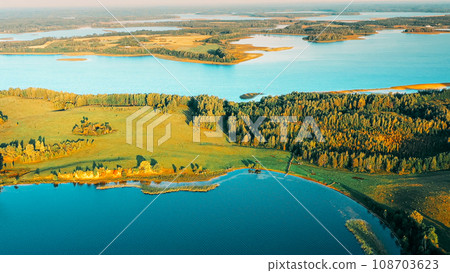 Aerial View Of Lake And Green Forest Landscape In Sunny Summer Aerial View Of Lake And Green Forest Landscape In Sunny Summer 108703623