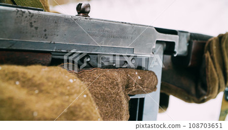 Usa Soldier With Old Thompson Sub-machine Gun. Close-up View Detail On Thompson Sub-machine Gun In Hands Of Re-enactor Dressed As American Infantry Soldier. Usa Army Soldiers Of World War Ii Usa Soldier With Old Thompson Sub-machine Gun. Close-up View Detail On Thompson Sub-machine Gun In Hands Of Re-enactor Dressed As American Infantry Soldier. Usa Army Soldiers Of World War Ii 108703651