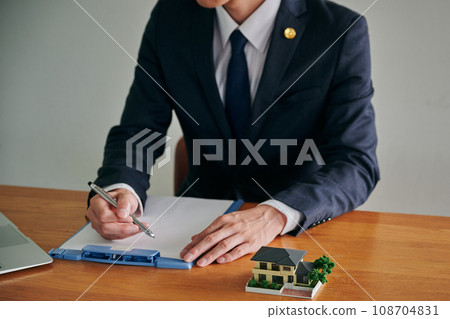 A male lawyer investigating the issue of empty houses at his parents' home A male lawyer investigating the issue of empty houses at his parents' home 108704831