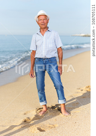 Ordinary mature man in headwear posing Ordinary mature man in headwear posing 108705111