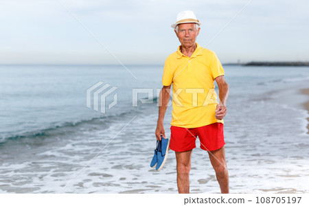 Portrait of happy mature man near the sea 108705197