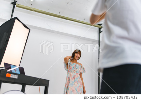 Shooting in a studio with a photographer 108705432