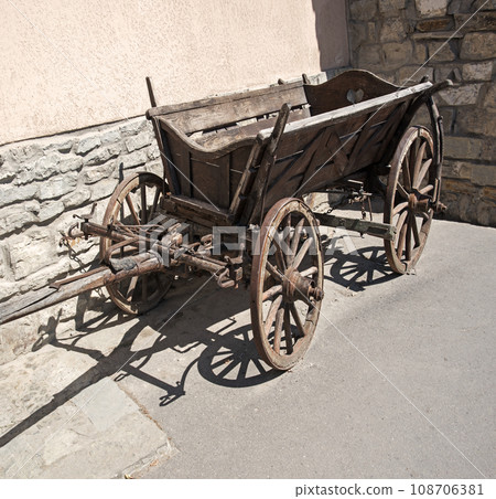Old wooden cart on the square Old wooden cart on the square 108706381