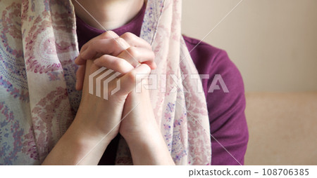 Praying woman fold her hands 108706385