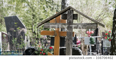 Old wooden crosses in the cemetery Old wooden crosses in the cemetery 108706402