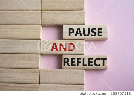 Pause and Reflect symbol. Concept words Pause and Reflect on wooden blocks. Beautiful pink background. Business and Pause and Reflect concept. Copy space. Pause and Reflect symbol. Concept words Pause and Reflect on wooden blocks. Beautiful pink background. Business and Pause and Reflect concept. Copy space. 108707118