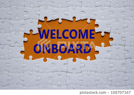 Welcome onboard symbol. Concept words Welcome onboard on white puzzle. Beautiful orange background. Business and Welcome onboard concept. Copy space. 108707167