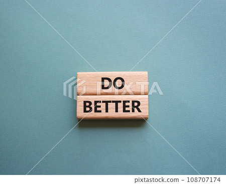 Do better symbol. Wooden blocks with words Do better. Beautiful grey green background. Business and Do better concept. Copy space. Do better symbol. Wooden blocks with words Do better. Beautiful grey green background. Business and Do better concept. Copy space. 108707174