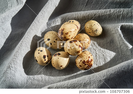 Quail eggs on a blue apron close-up. 108707306