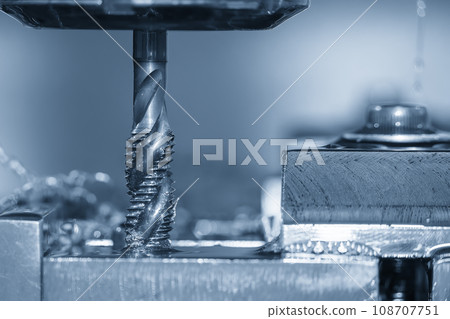 Close up scene the machine tapping process the metal plate by CNC milling machine. Close up scene the machine tapping process the metal plate by CNC milling machine. 108707751