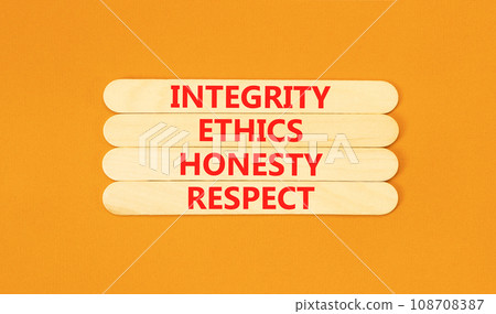 Integrity ethics honesty respect symbol. Concept word Integrity Ethics Honesty Respect on beautiful wooden stick. Beautiful orange table background. Business integrity ethics honesty respect concept. 108708387